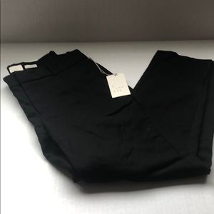 Slim ankle mid rise ankle has a slit at the bottom